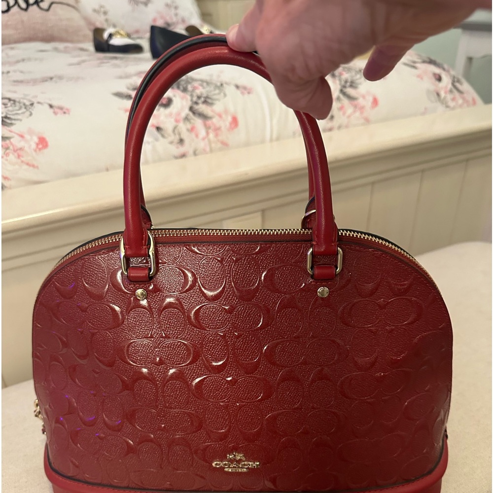 Coach red purse hard to find one like it.